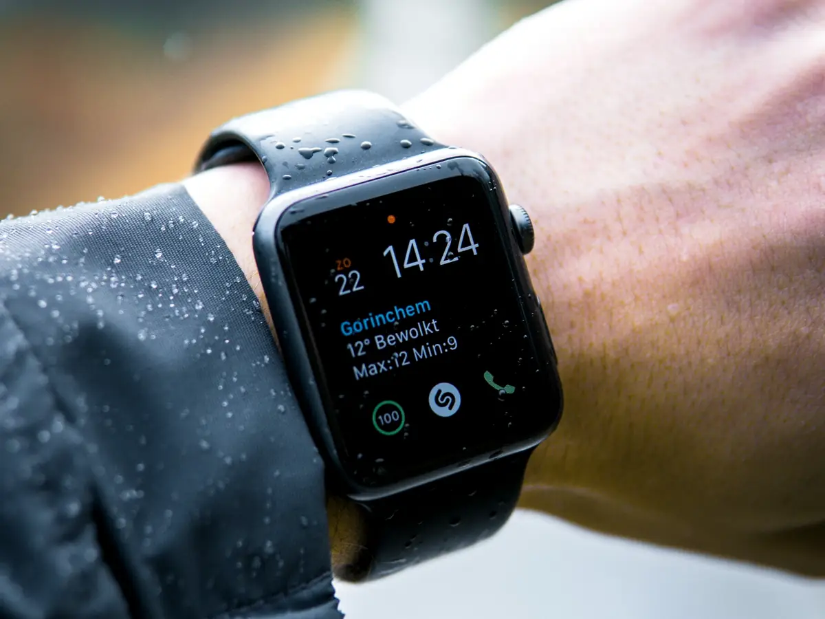 Smartwatch on a runner’s wrist showing live fitness activity data
